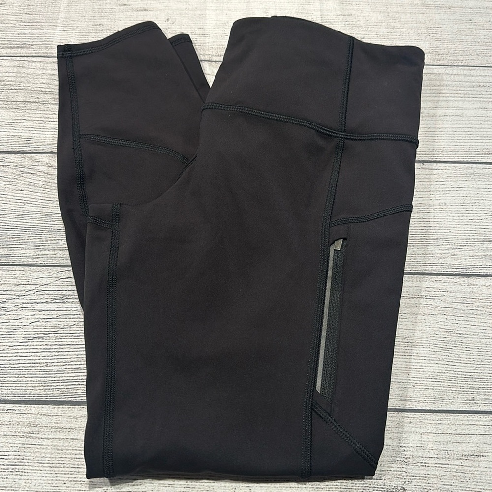 Women’s Athleta black Rainier Tight legging size L